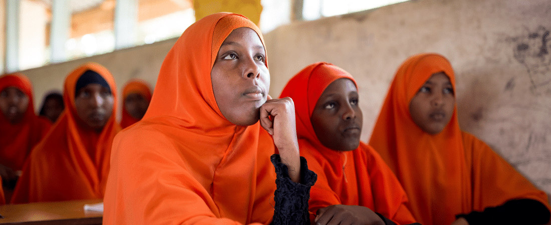 Young girls participating in a lesson at school in a refugee camp in Kenya.
