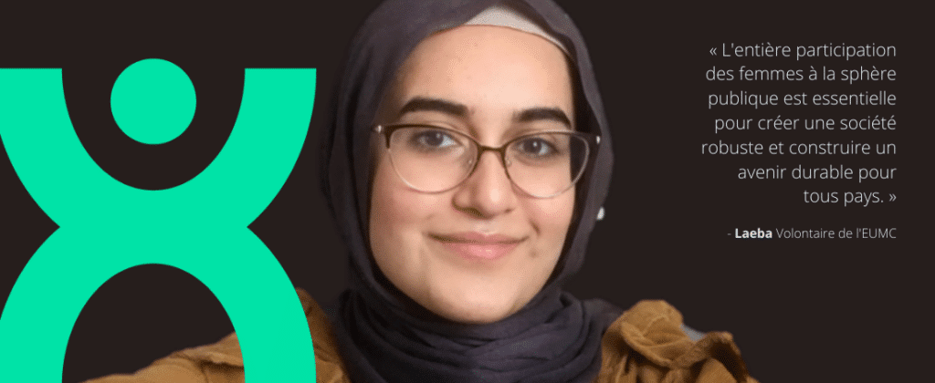A woman looks at the camera.